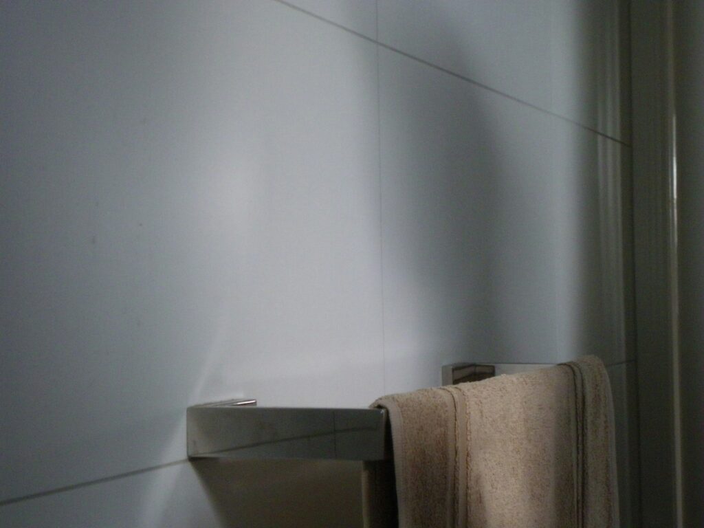 a towel hanging on a towel rack in a bathroom